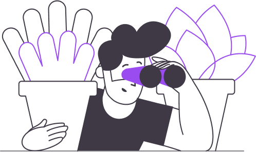 Junge mit Fernglas hinter Pflanzen